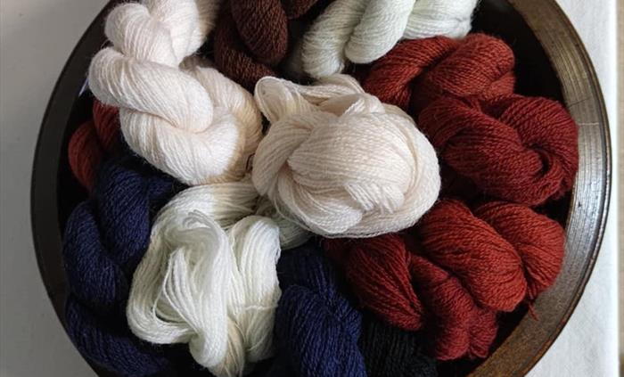 Weaving Yarns in a traditional pallet of Indigo Madder and Natural Whites